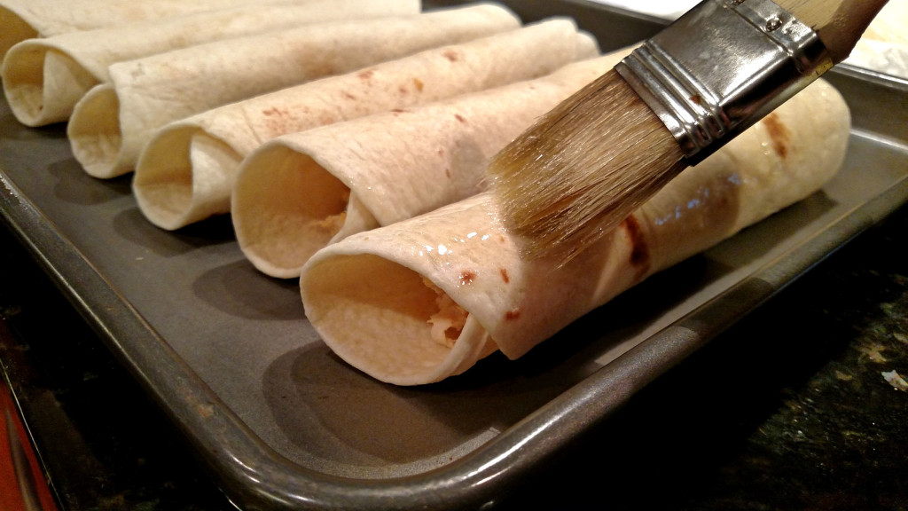 brushing tortillas with oil