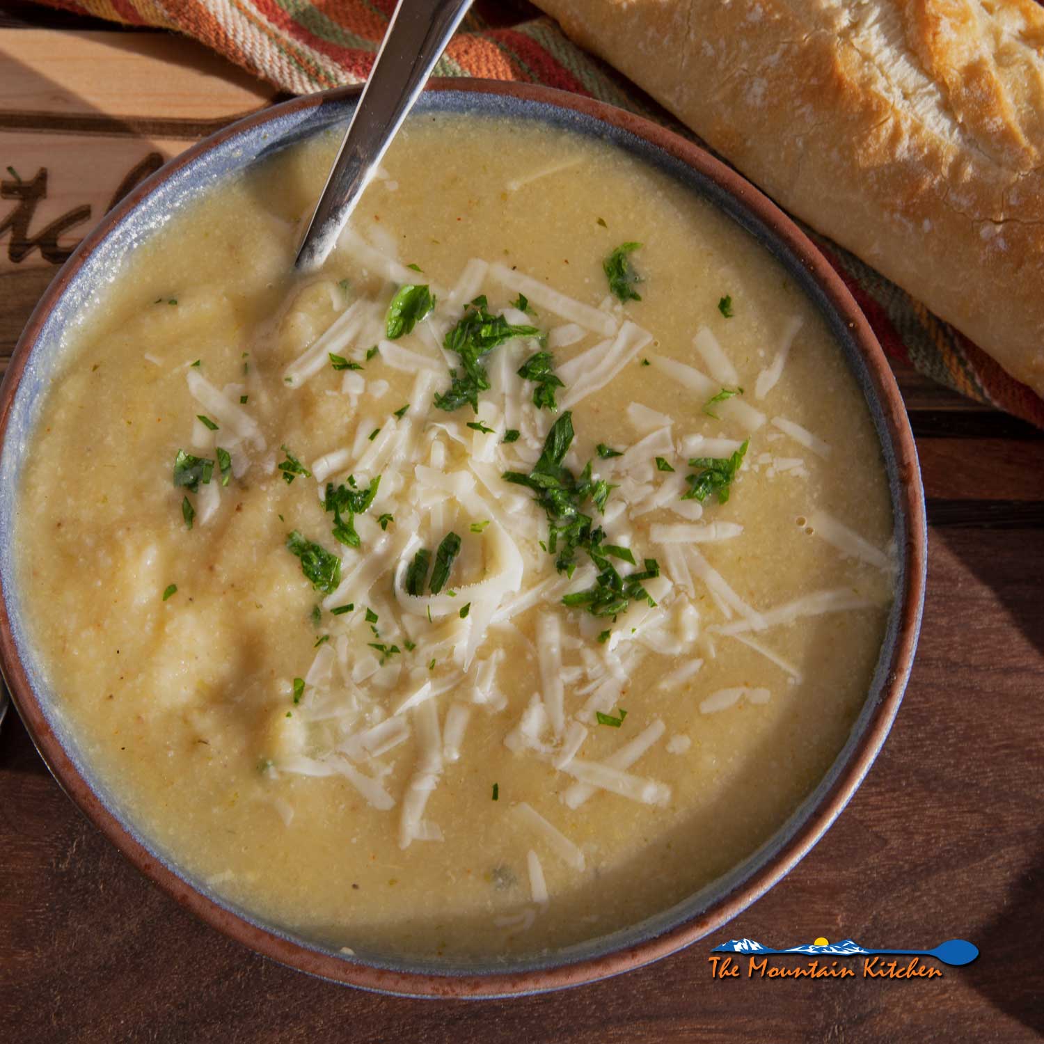 roasted cauliflower soup in bowl with spoon