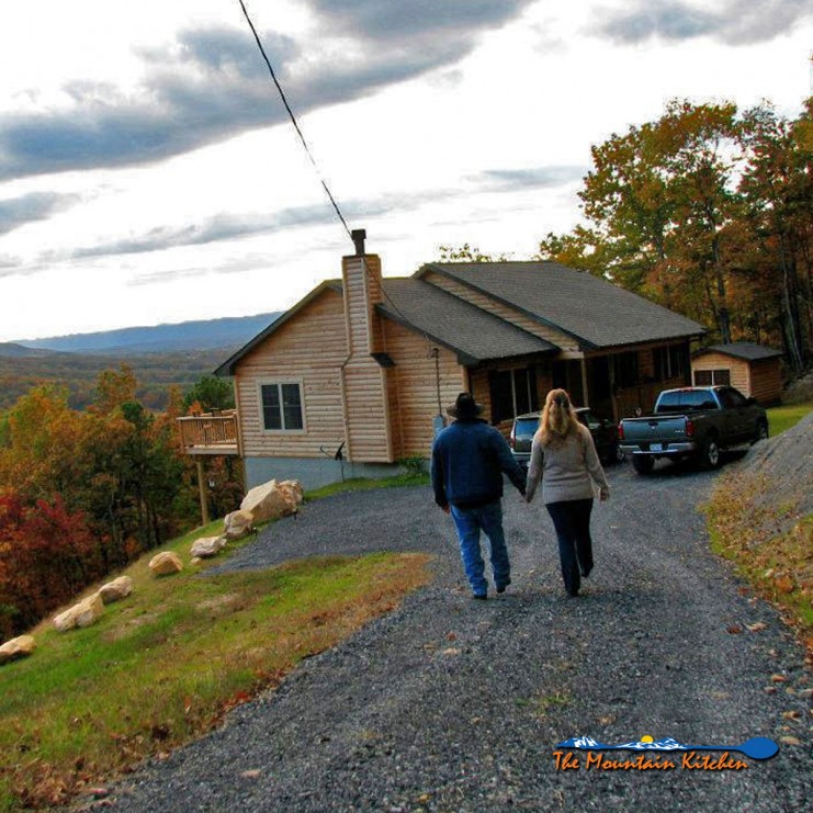 David and Debbie walking down the driveway to their mountain home
