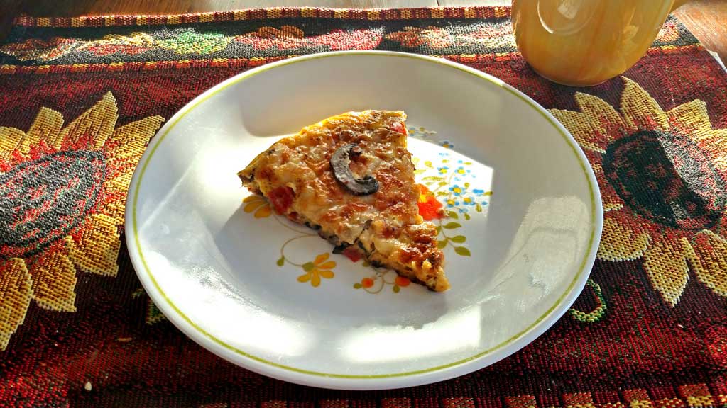slice of vegetable fritatta on plate