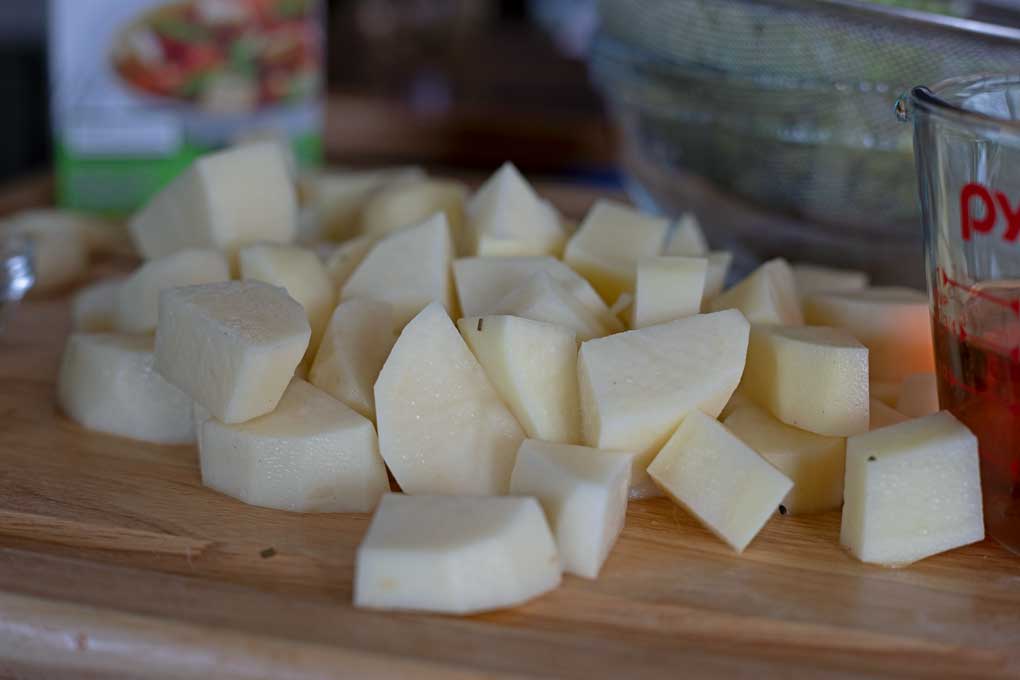 chopped potatoes on cutting board