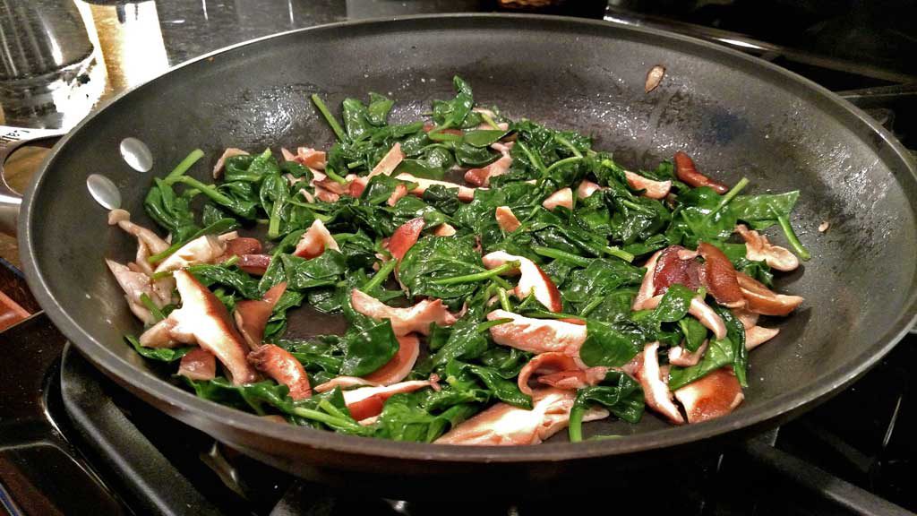mushrooms and spinach in pan
