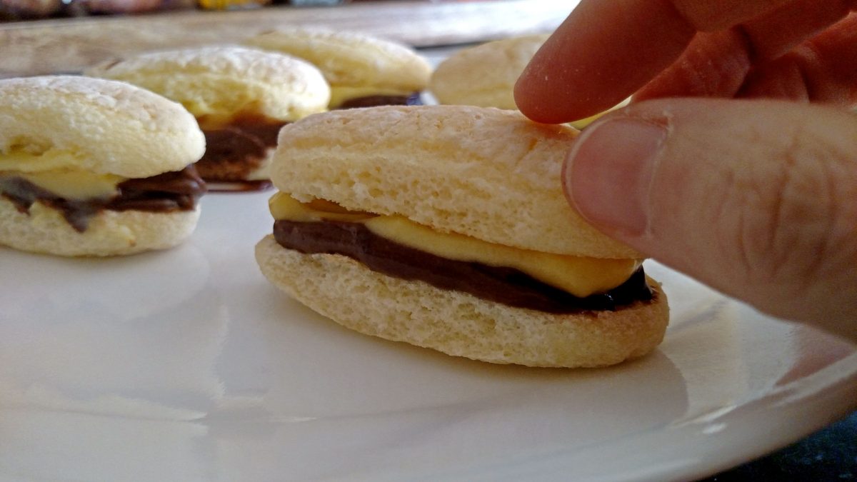 placing top on eclair