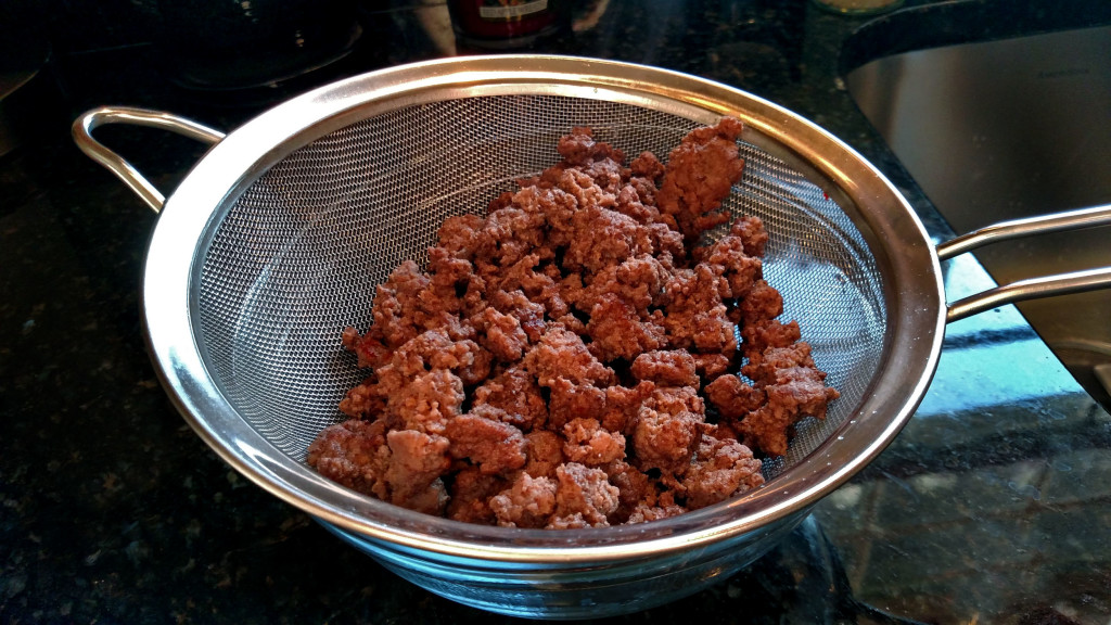 cooked hamburger draining