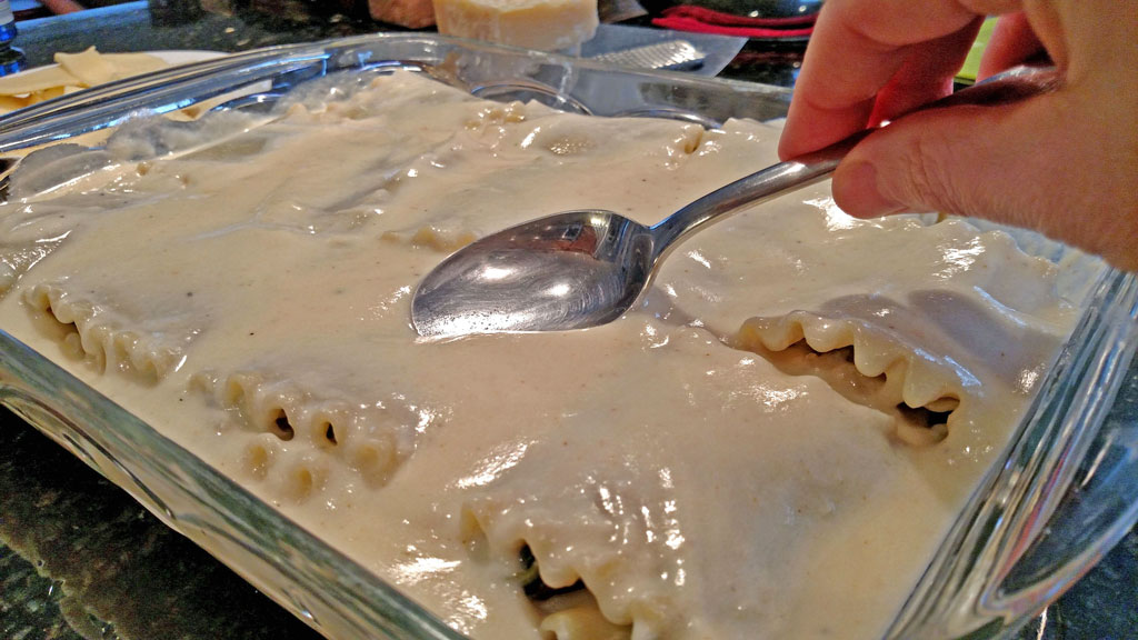 smoothing sauce out with spoon