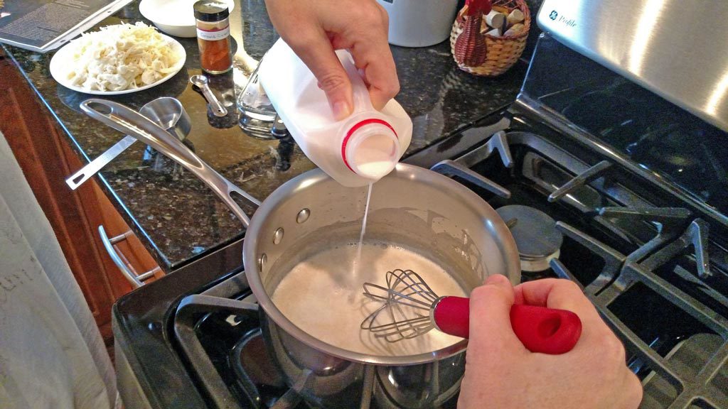 pouring milk into pot