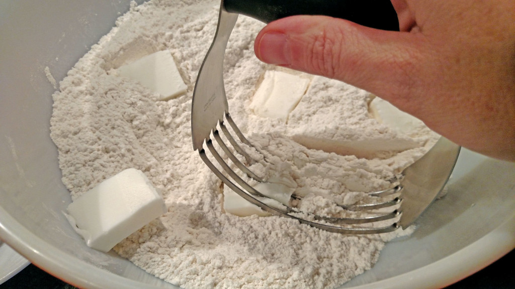 dough cutter cutting lard into flour
