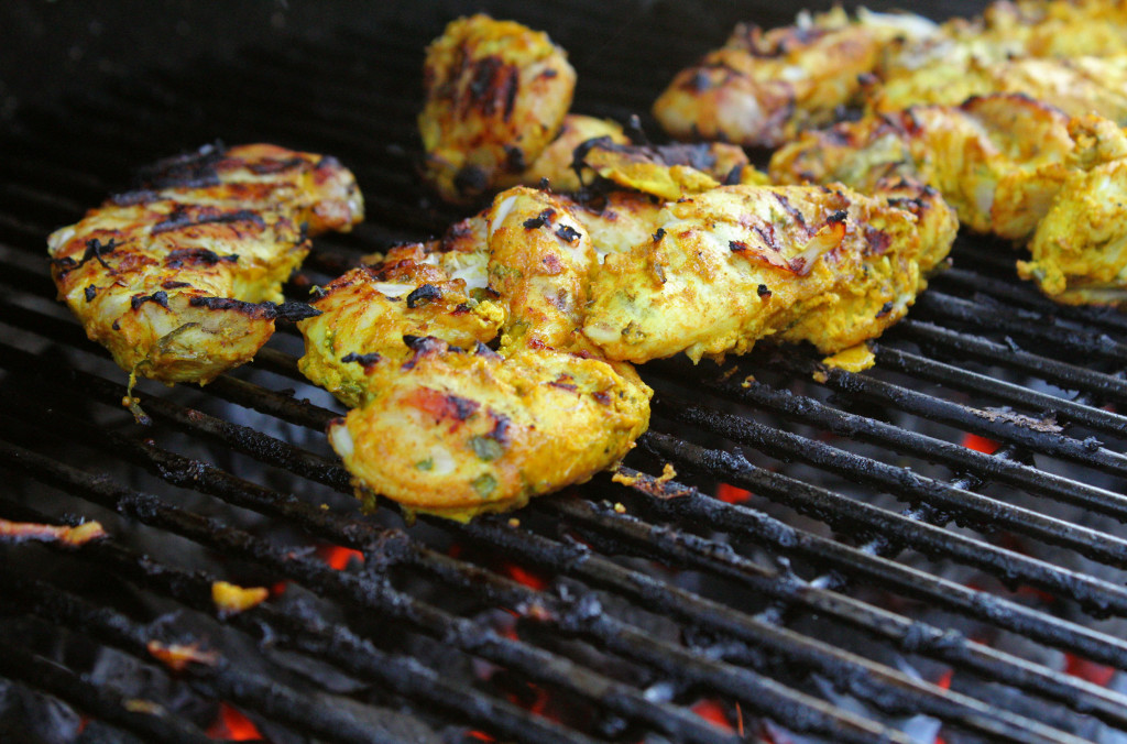 tandoori chicken cooking on grill