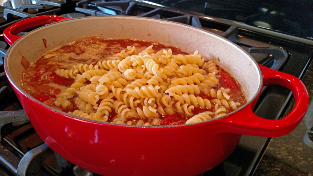 pasta in pot of soup on stove