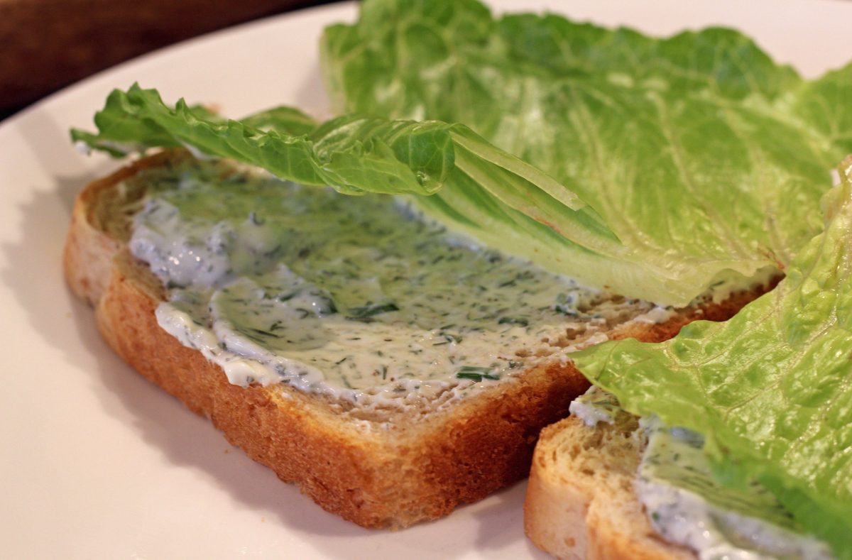 lettuce and yogurt dill sauce on bread