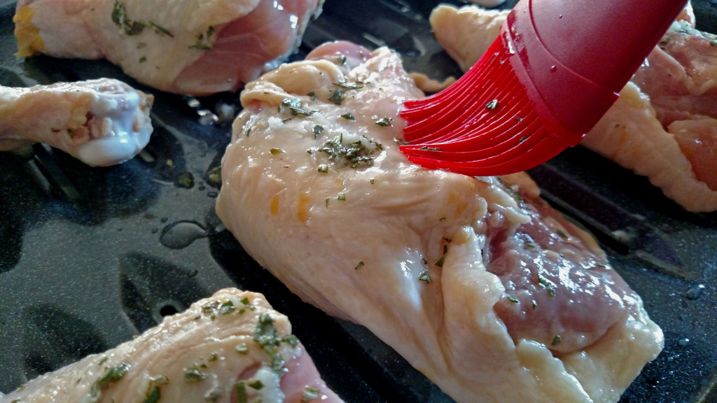 brushing chicken with mustard sauce