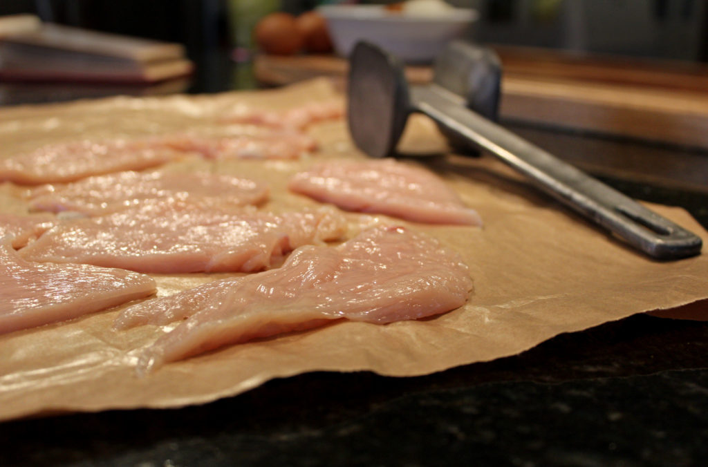 flattened chicken with mallet