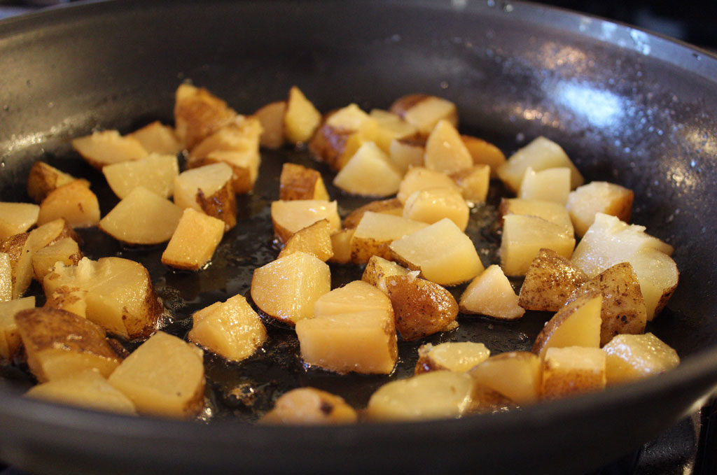 potatoes cooking in the pan