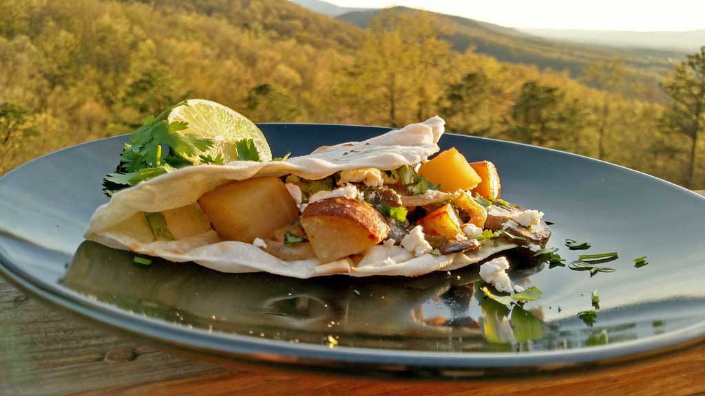 Tacos, filled with roasted poblano peppers, sauteed mushrooms and onions with country-style skillet potatoes served in a cream sauce with a hint of lime. | TheMountainKitchen.com