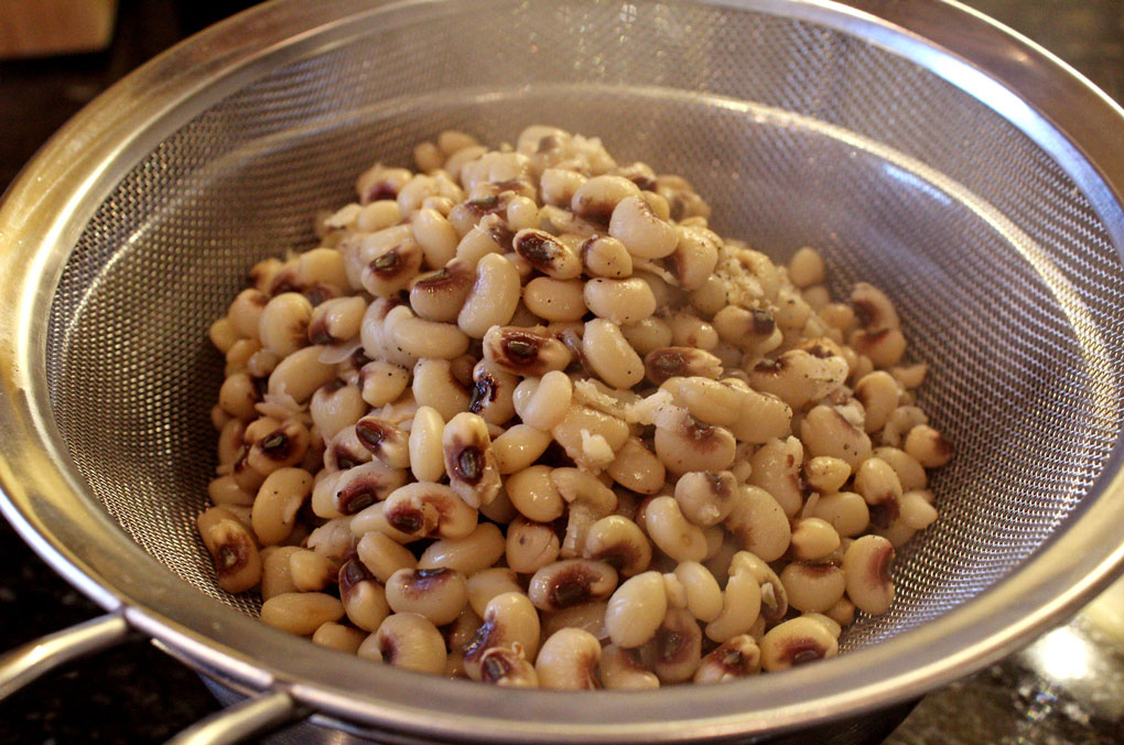 peas draining in sieve