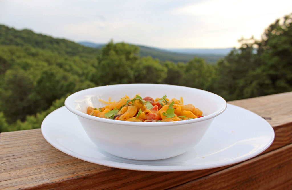 bowl of Cajun Chili Mac with mountain view