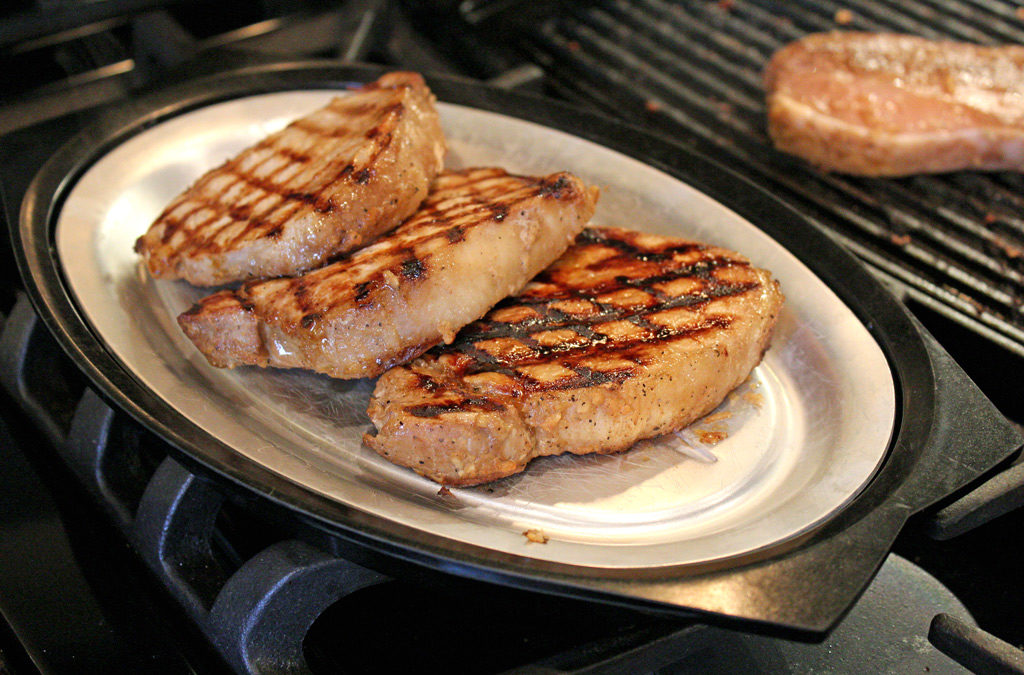grilled teriyaki pork chops on platter