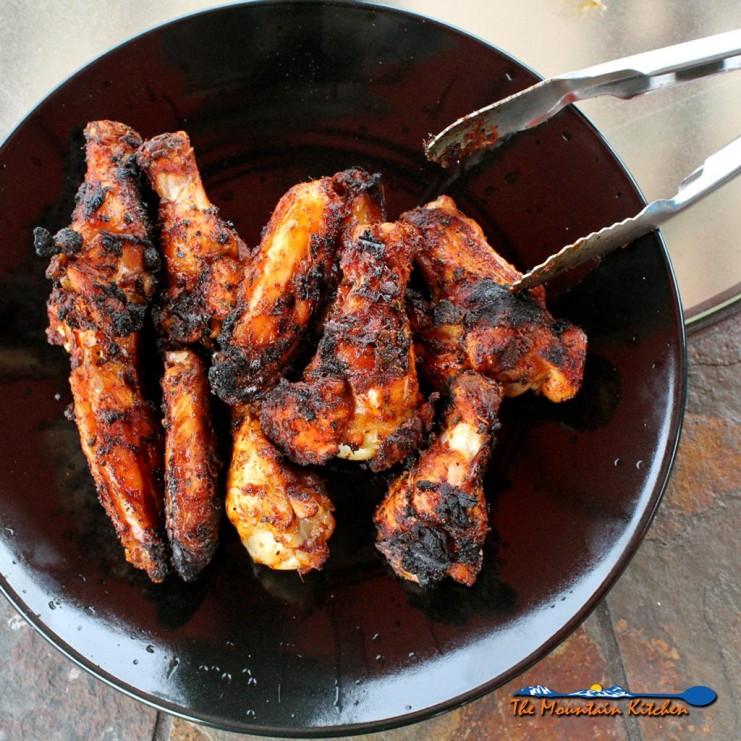 Grilled Cajun Chicken Wings on black plate