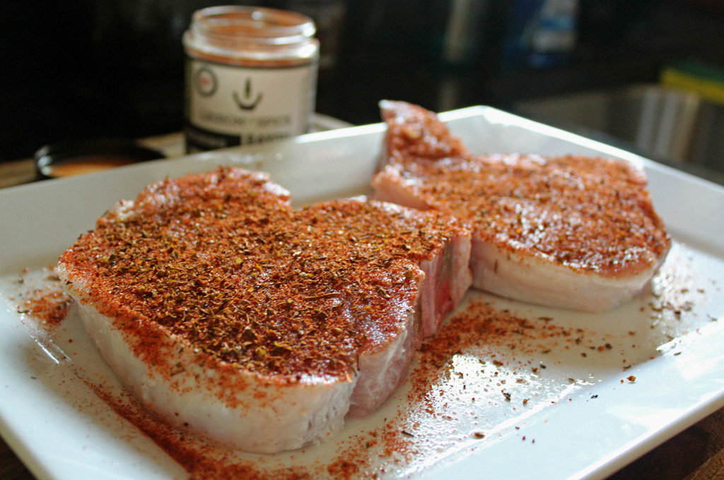 seasoned pork chops on platter