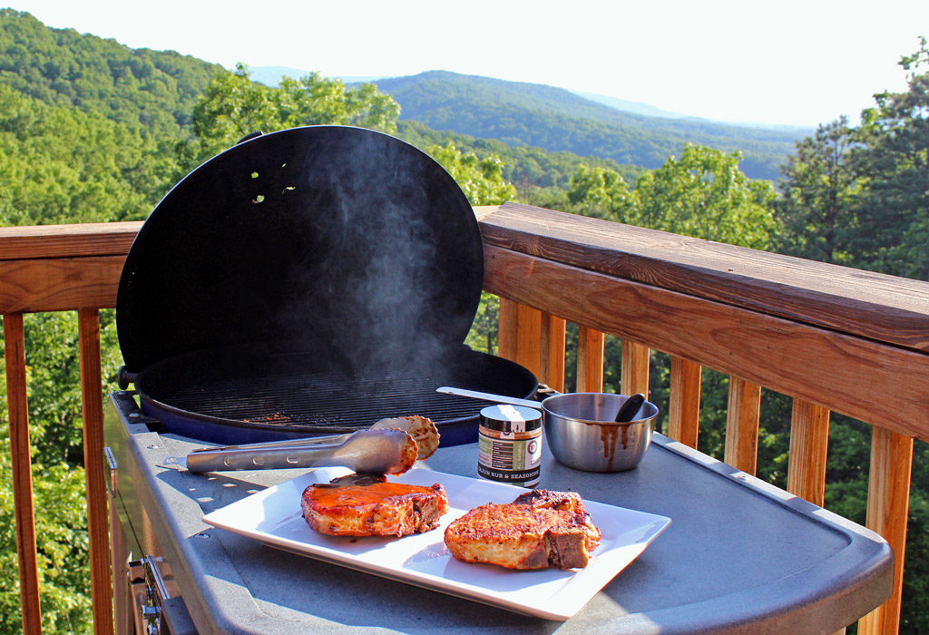 pork chops ready to grill with mountain view