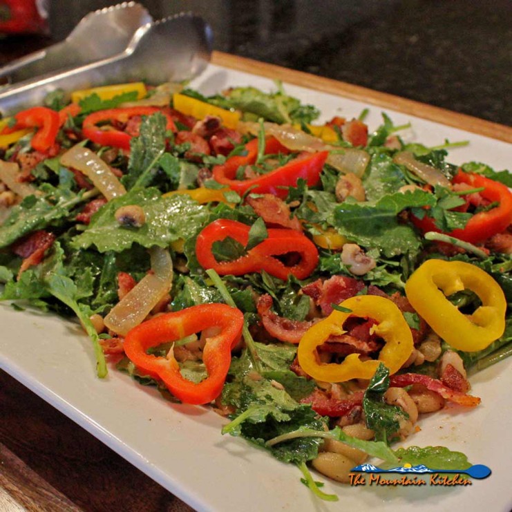 kale salad with peas on platter ready to eat