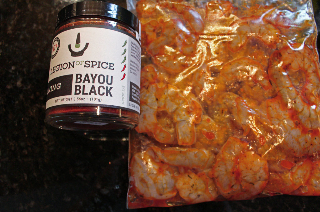 shrimp in zip-top bag with cajun seasoning