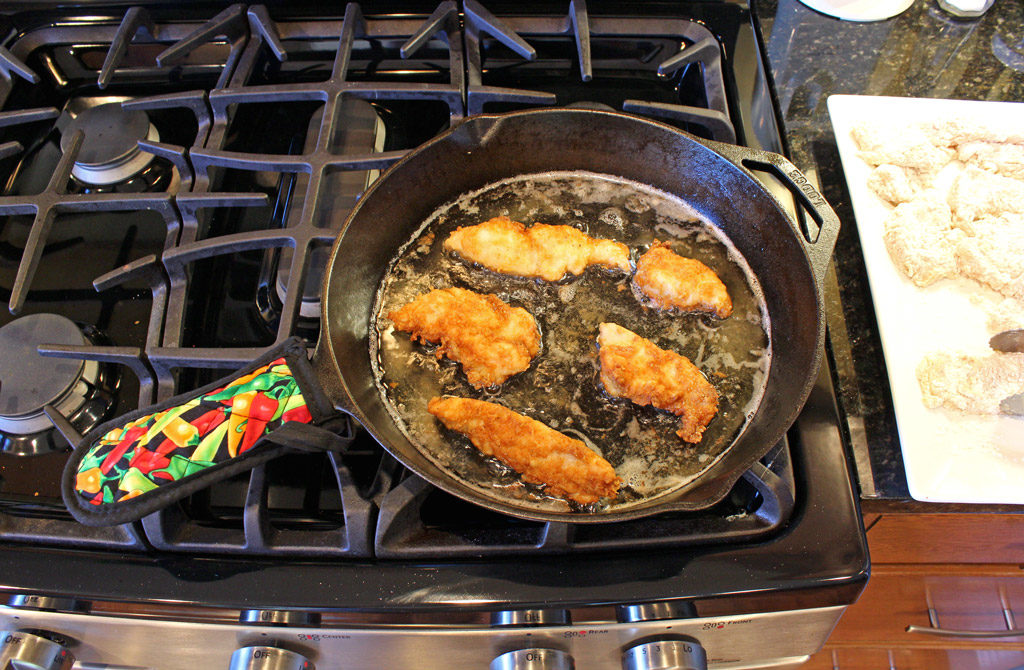 frying chicken tenders in pan