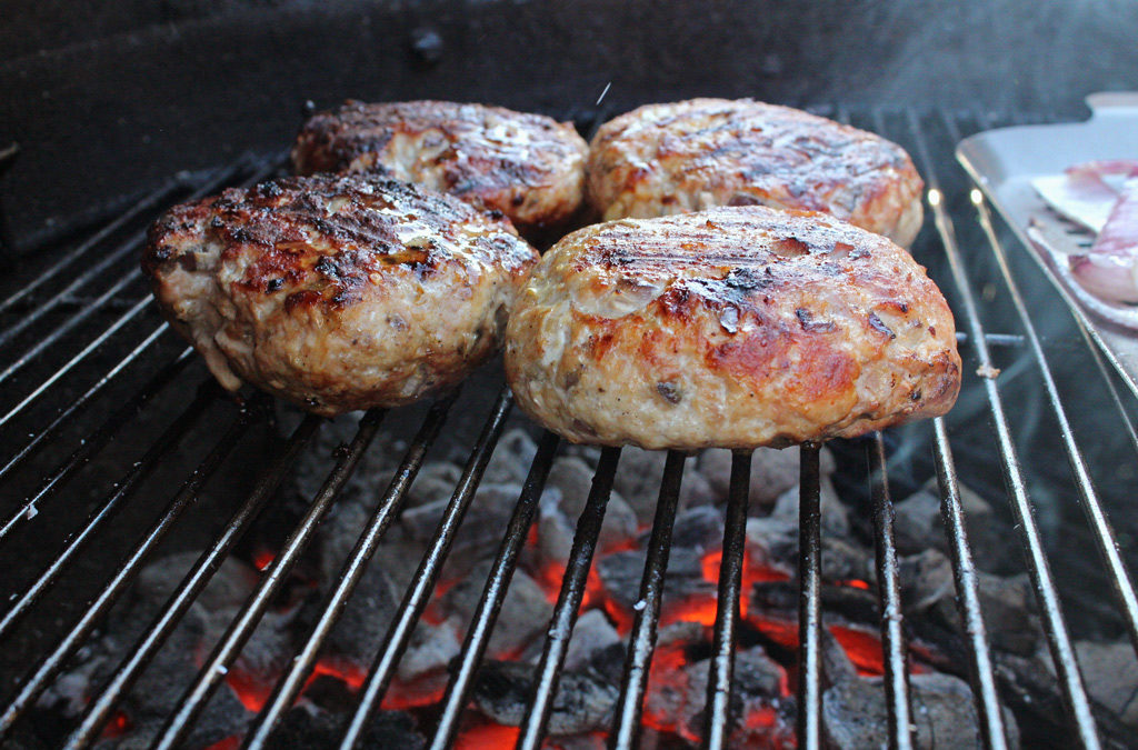 Curried Pork Burger cooking on grill