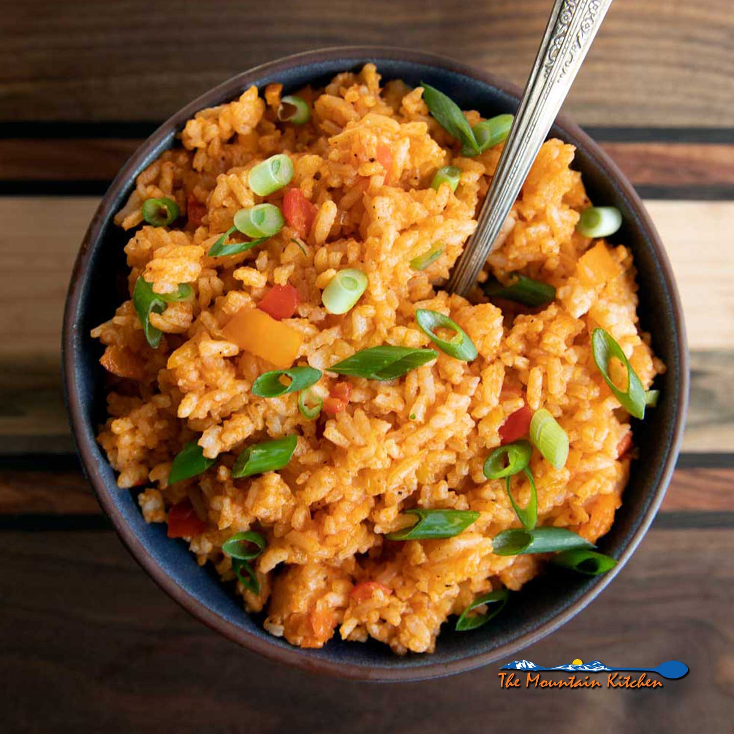 Cajun rice in bowl with spoon