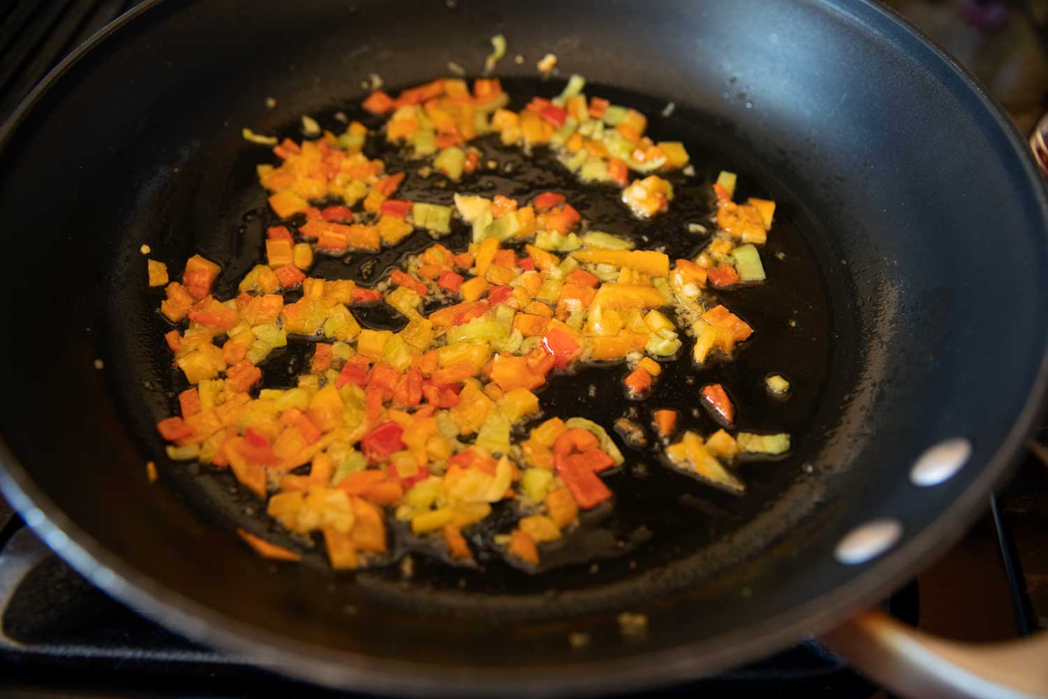 peppers and garlic in skillet
