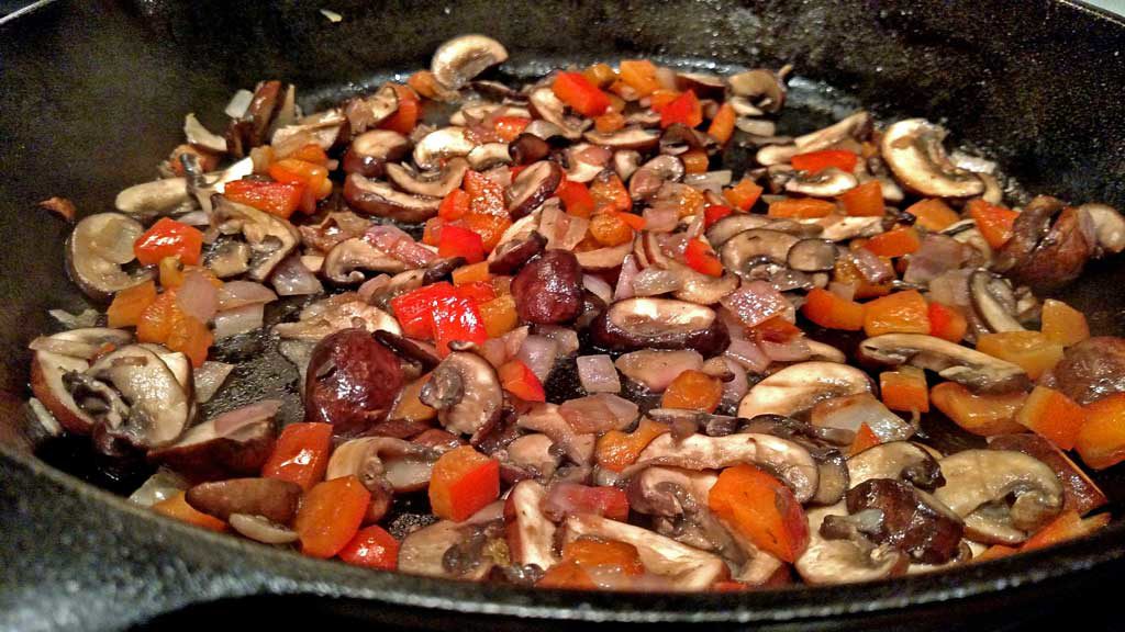 vegetables sauteing in pan