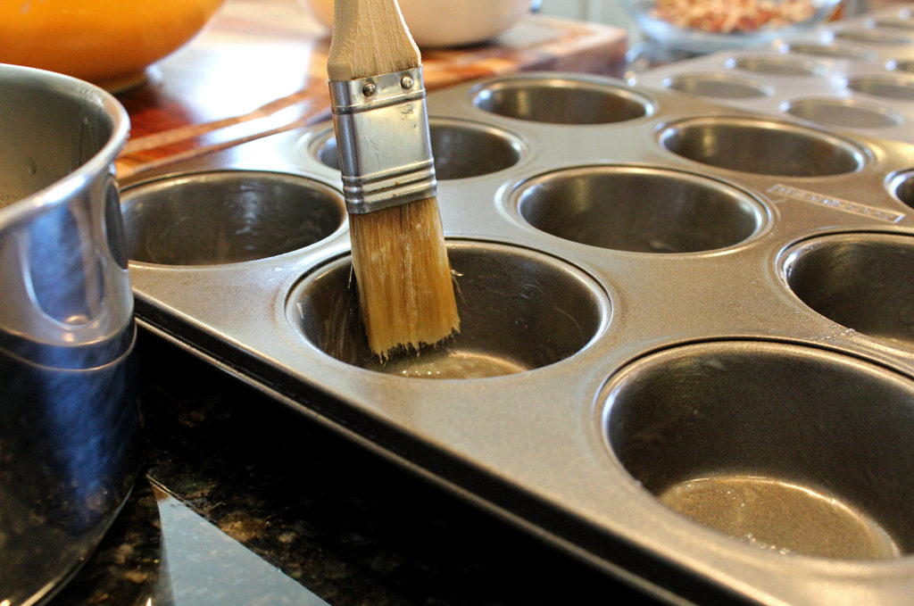 brushing muffin tin