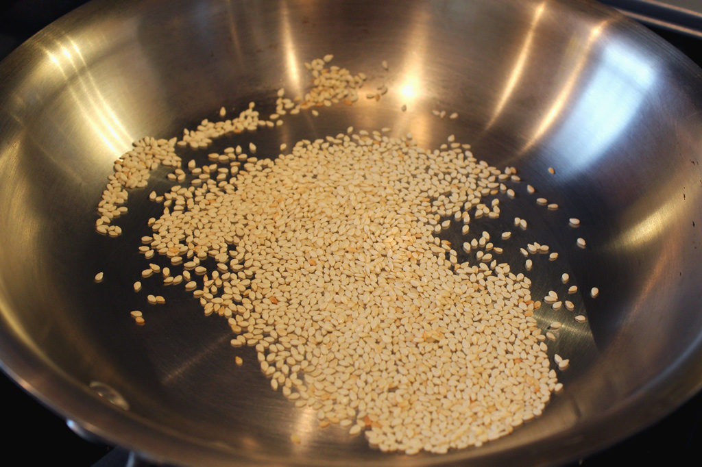 sesame seeds toasting in skillet