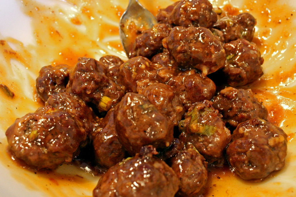 meatballs tossed in bowl with sauce