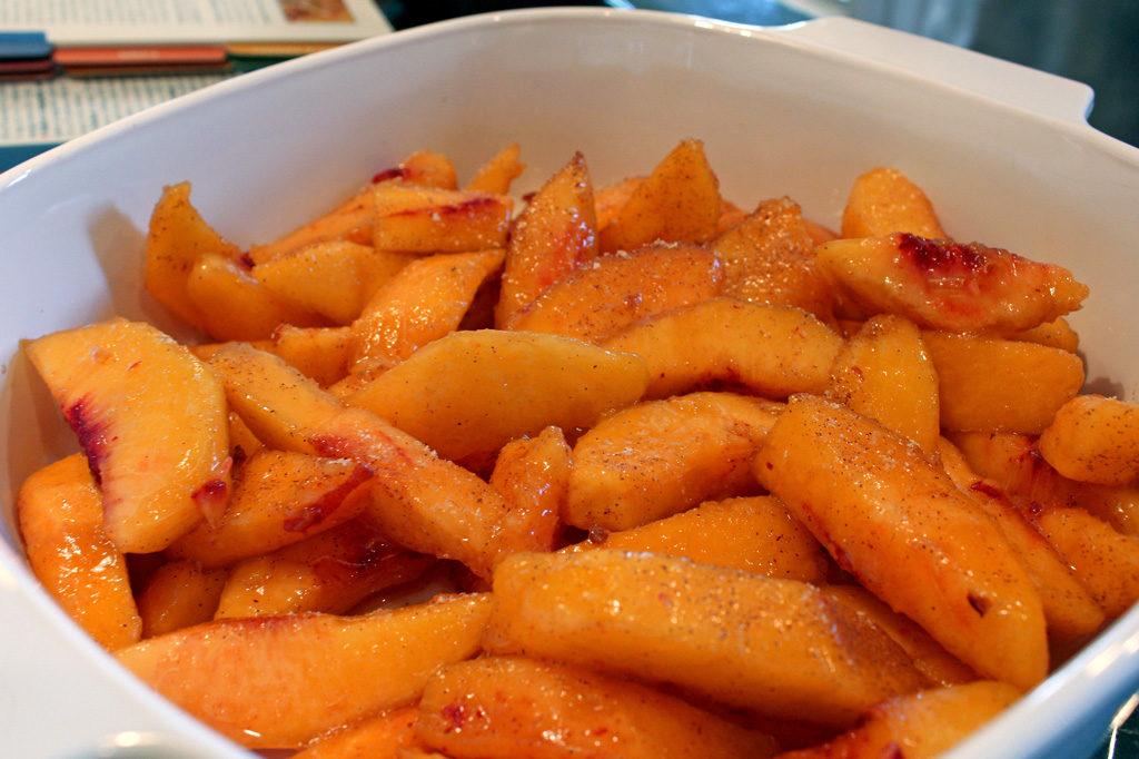 seasoned sliced peaches inside casserole dish