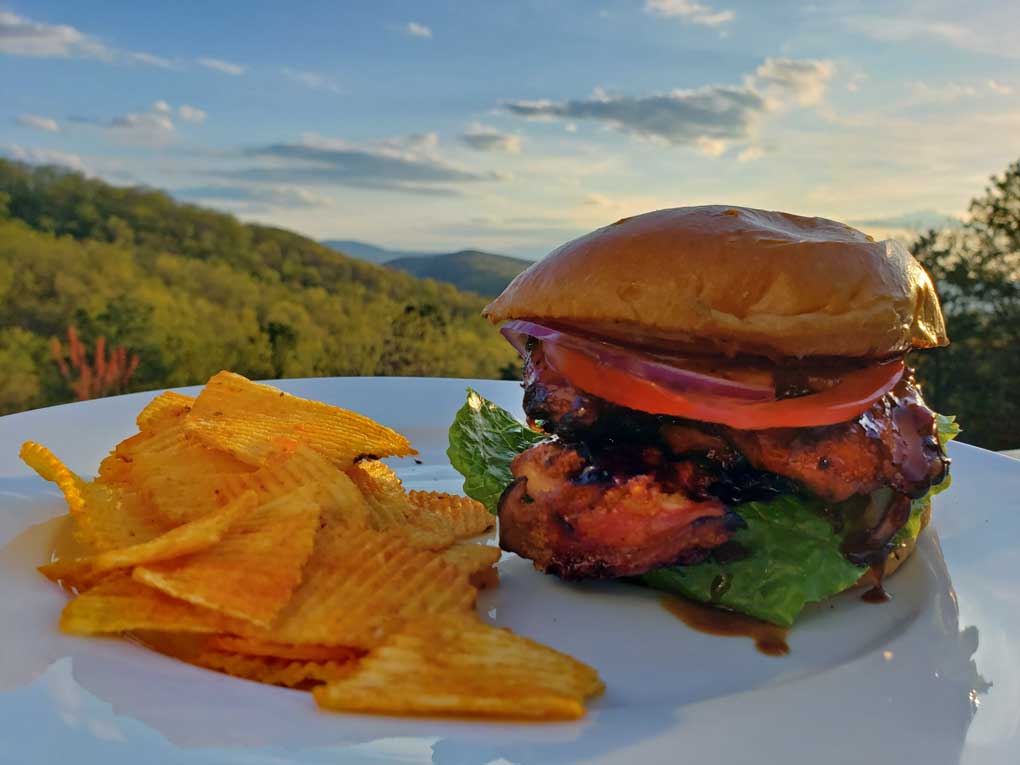 grilled teriyaki chicken sandwich on plate with chips