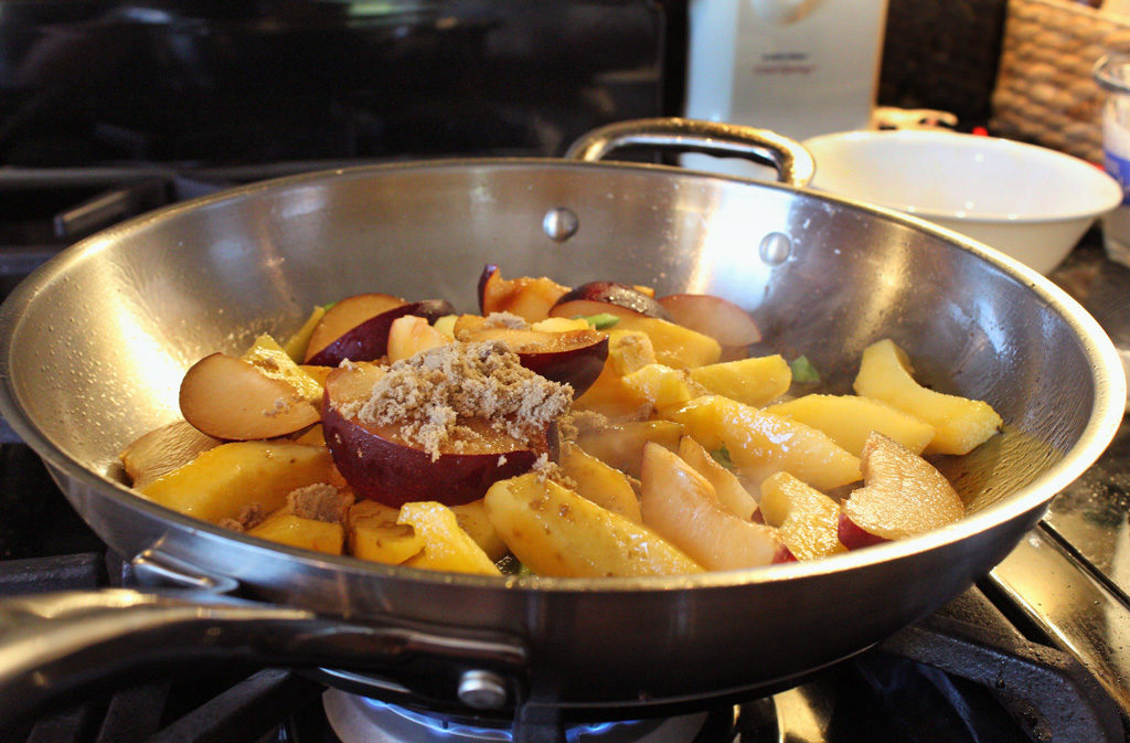 plums and peaches added to pan