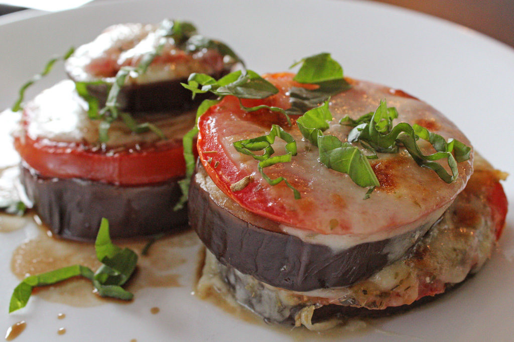 Roasted Eggplant Caprese Stacks on a plate read to eat