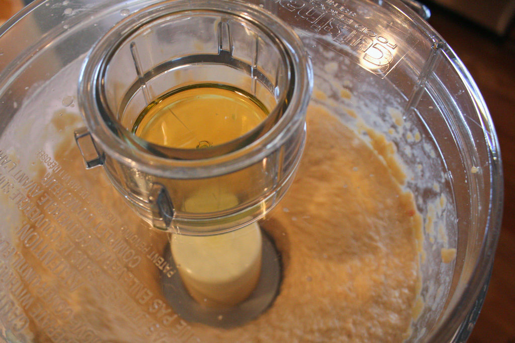 blending the oil into the hummus