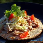 Smoked Pork Carnitas with Spicy Cabbage served on a tortilla