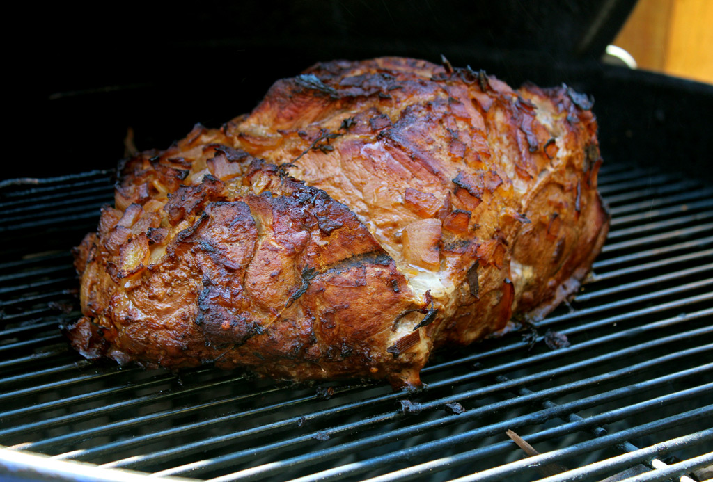 Smoked pork shoulder on grill