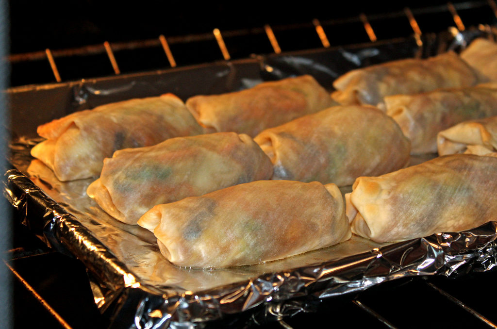 These baked vegetable egg rolls are baked, not fried and loaded with fresh vegetables, seasoned with ginger, garlic and soy sauce, with a tasty honey sesame dipping sauce. | TheMountainKitchen.com
