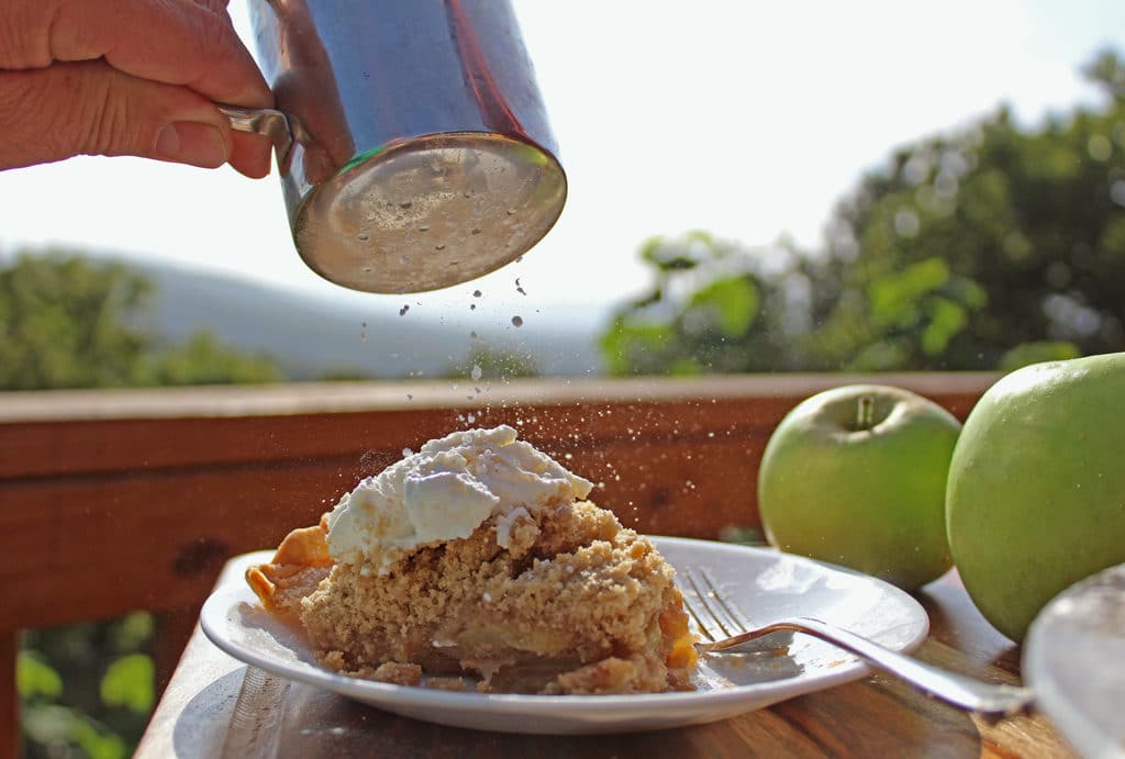 sifting sugar on top of pie
