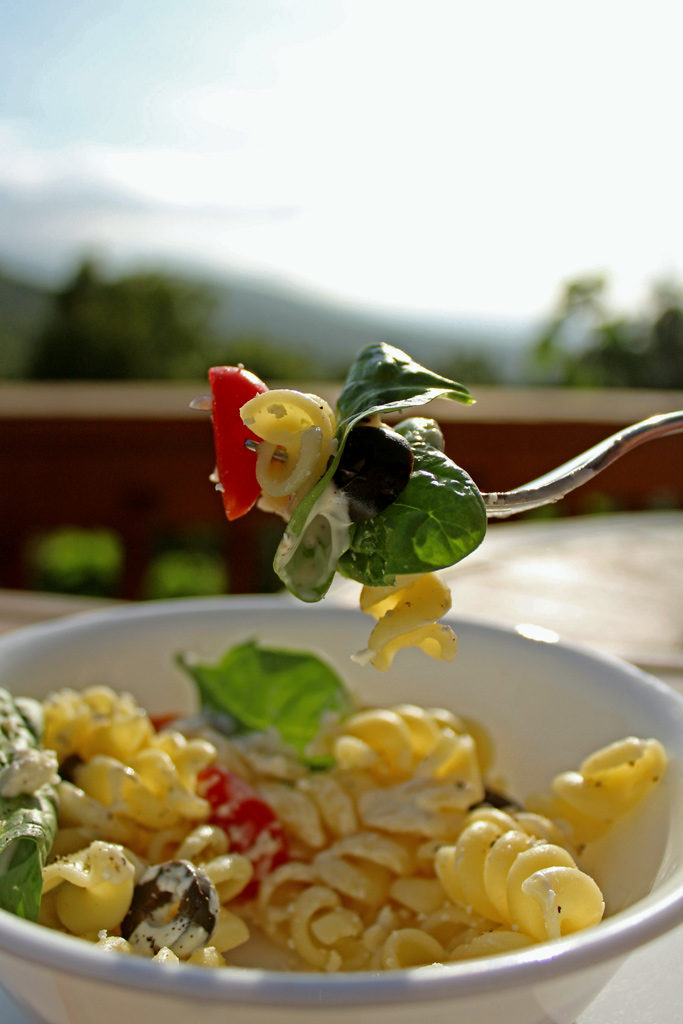 spoonful of salad with mountain view