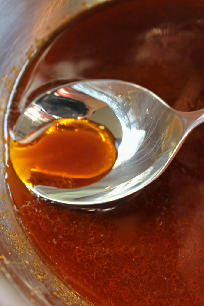 skimming grease with spoon