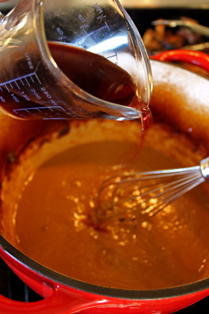 pouring wine in pot
