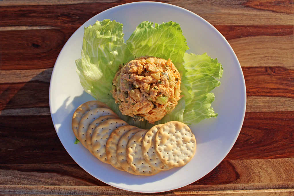 roasted chicken salad with crackers on plate