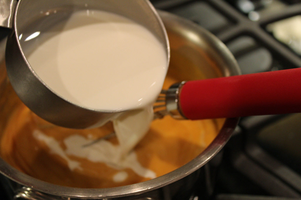pouring milk into pot
