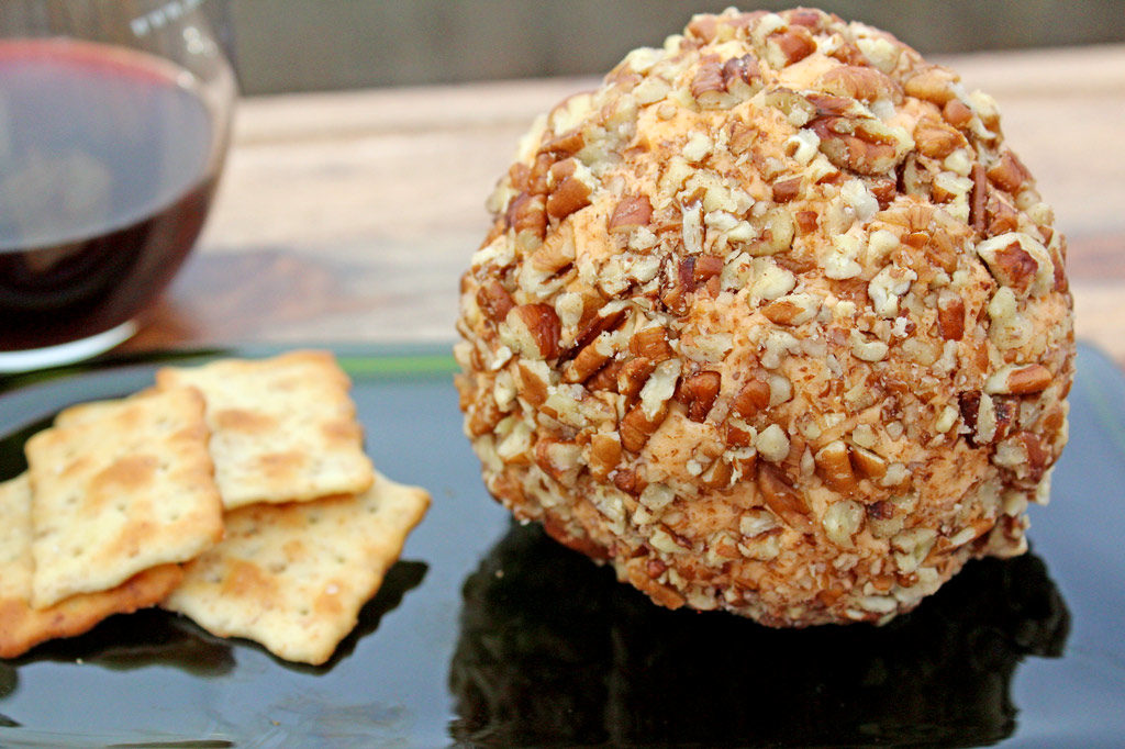 Mama's Christmas cheese ball with crackers and wine