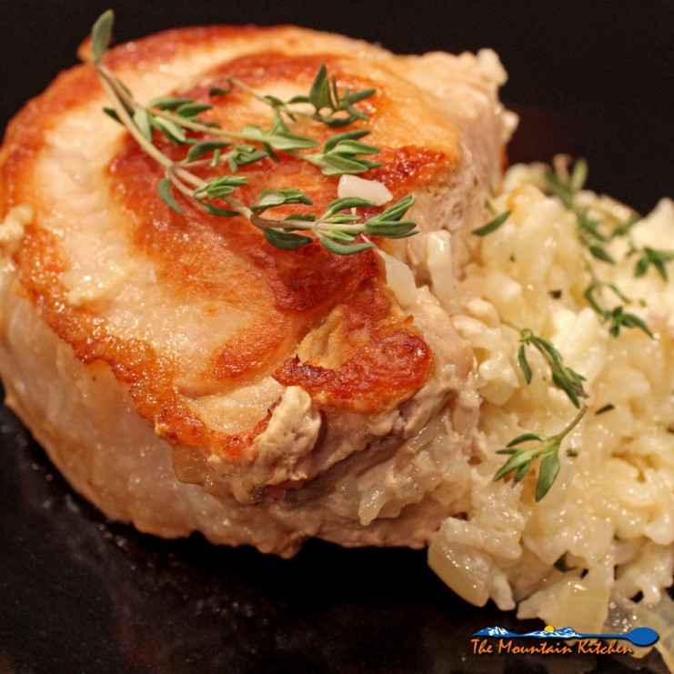 cheesy rice stuffed pork chop on plate ready to eat
